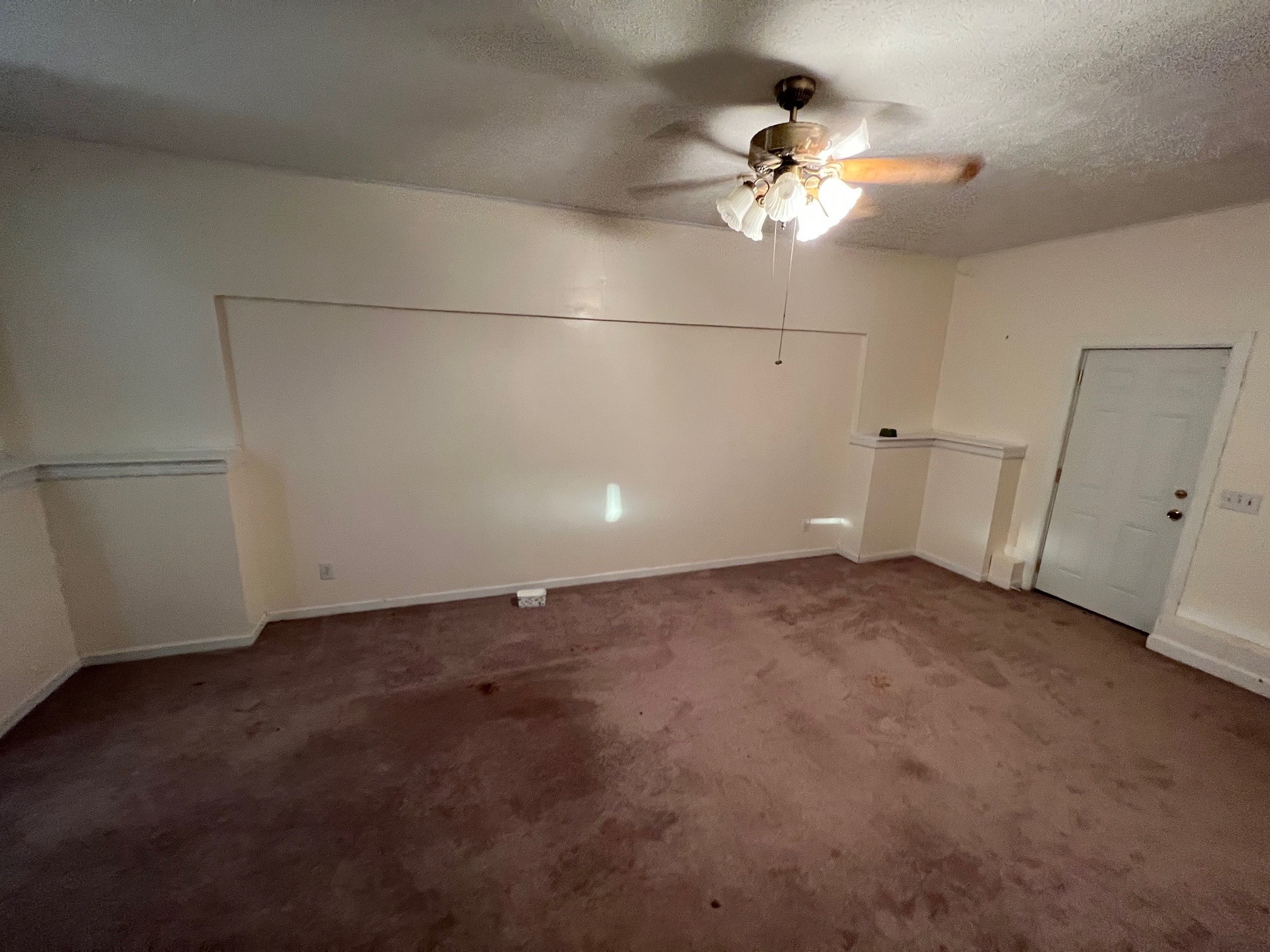 1058 Halls Mill Road Unionville, TN 37180 - Photo 13 of 32 a view of a livingroom with a ceiling fan and window