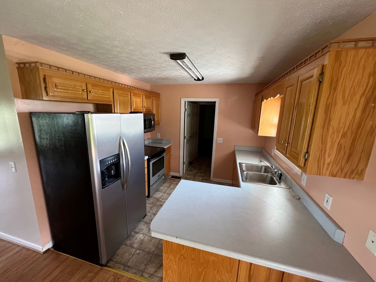1058 Halls Mill Road Unionville, TN 37180 - Photo 25 of 32 a kitchen with stainless steel appliances a refrigerator and a counter space