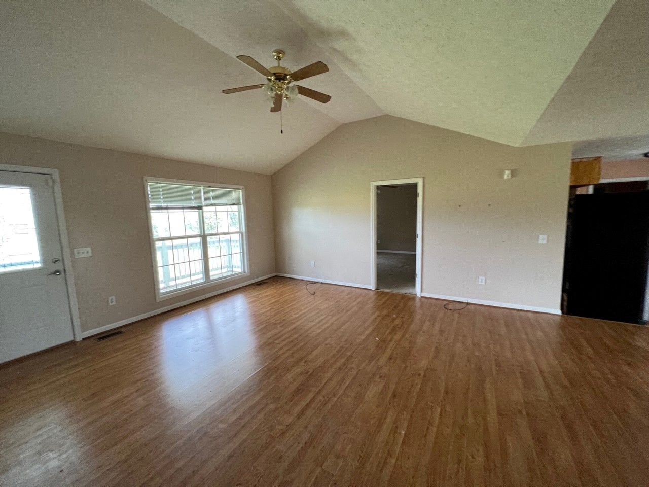 1058 Halls Mill Road Unionville, TN 37180 - Photo 28 of 32 a view of an empty room with a window and wooden floor
