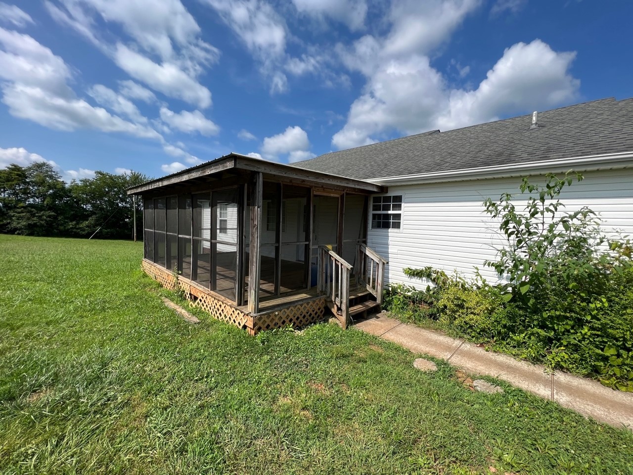 1058 Halls Mill Road Unionville, TN 37180 - Photo 30 of 32 a view of backyard with barbeque grill and potted plants