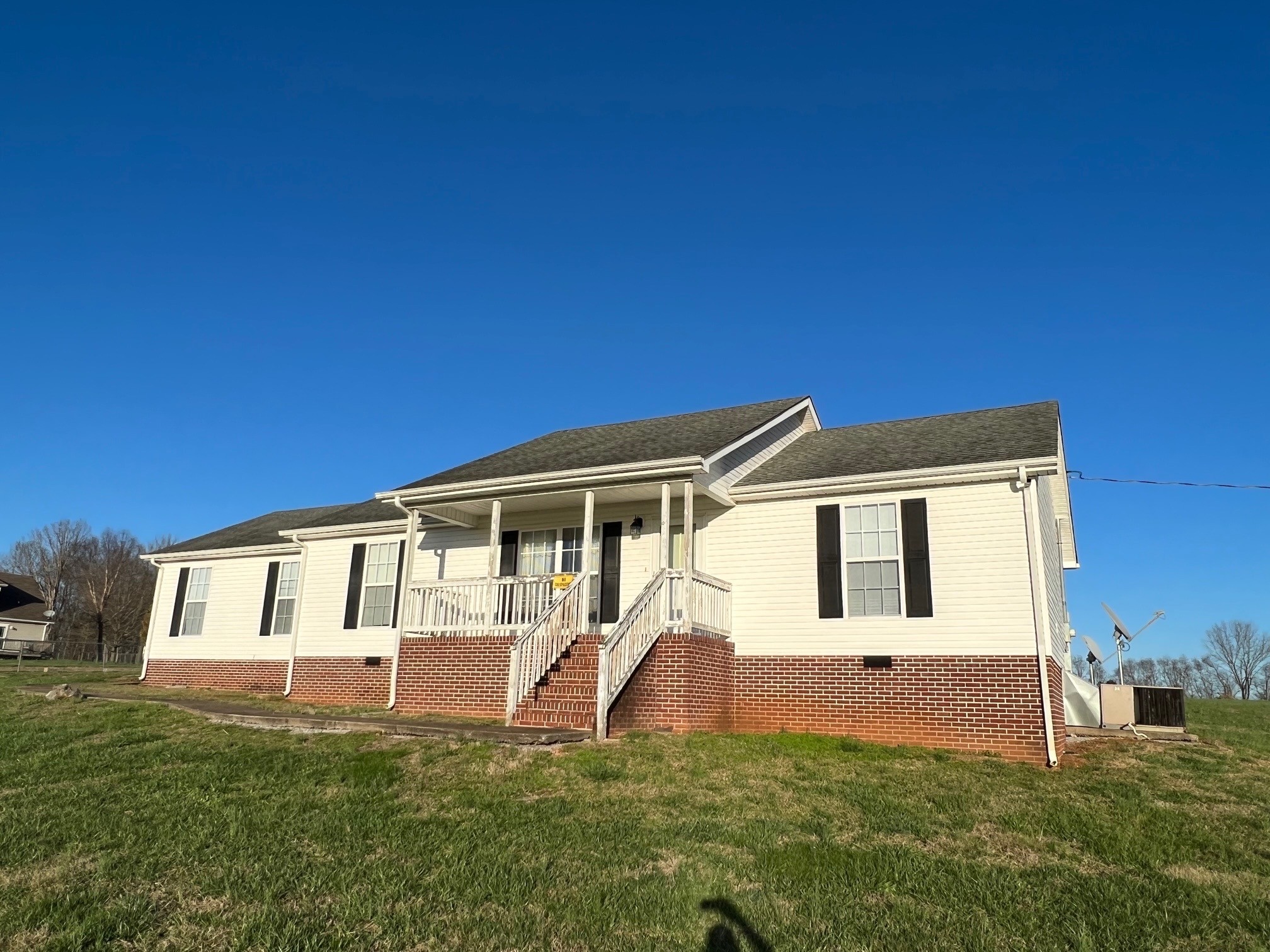 1058 Halls Mill Road Unionville, TN 37180 - Photo 4 of 32 a front view of a house with a yard