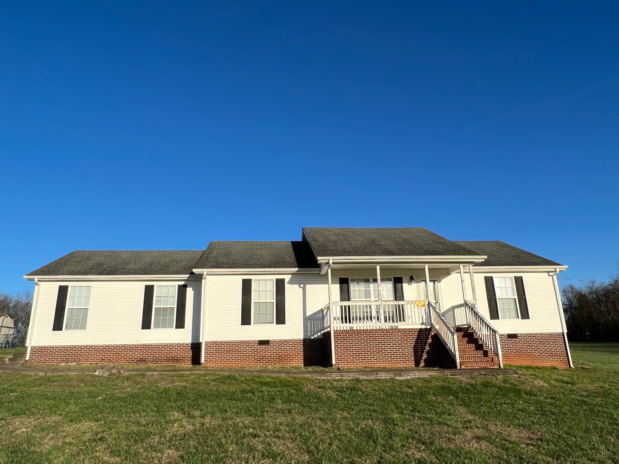 1058 Halls Mill Road Unionville, TN 37180 - Photo 5 of 32 a front view of a house with a yard
