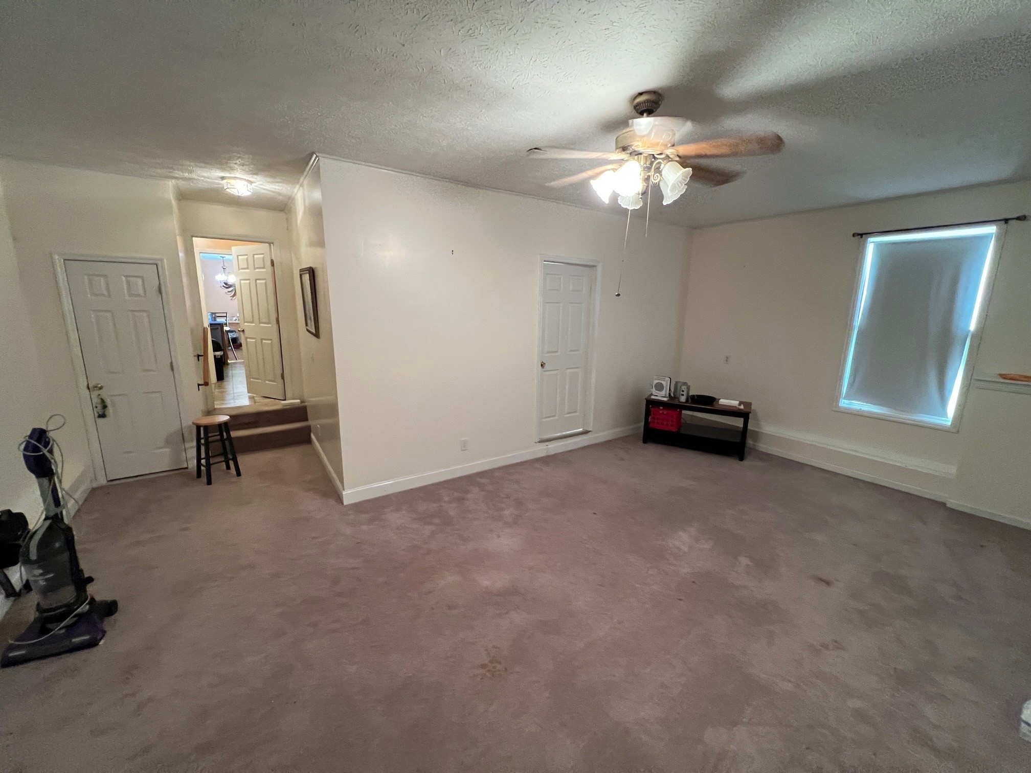 1058 Halls Mill Road Unionville, TN 37180 - Photo 8 of 32 a view of a room with gym equipment and a chandelier