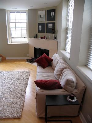 25 Ronan Road, Unit 206 Highwood, IL 60040 - Photo 2 of 3 a living room with furniture and a fireplace