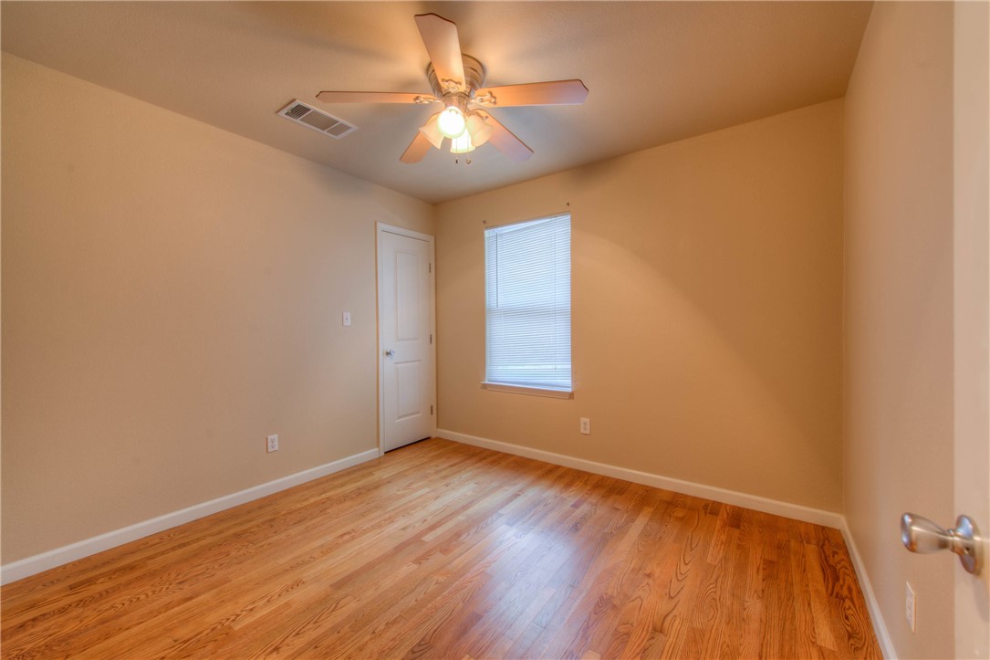 4805 Evans Avenue, Unit B Austin, TX 78751 - Photo 14 of 25 an empty room with a window and wooden floor