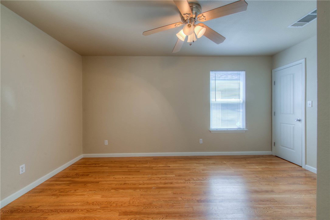 4805 Evans Avenue, Unit B Austin, TX 78751 - Photo 15 of 25 wooden floor in an empty room with a window