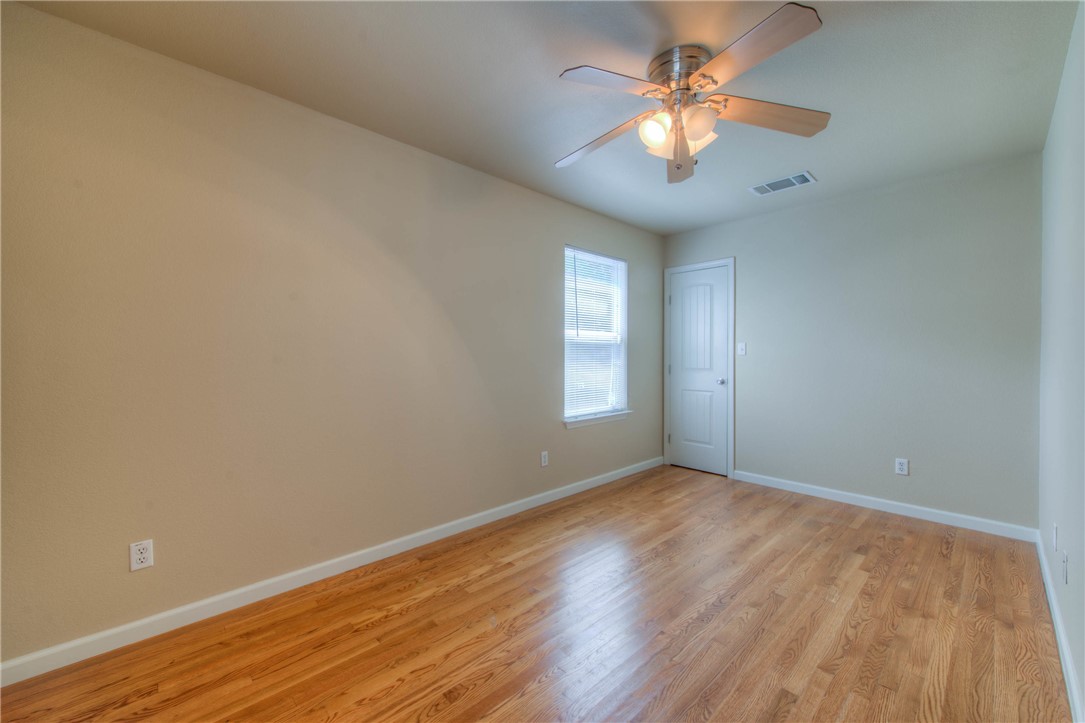 4805 Evans Avenue, Unit B Austin, TX 78751 - Photo 16 of 25 wooden floor in an empty room with a window