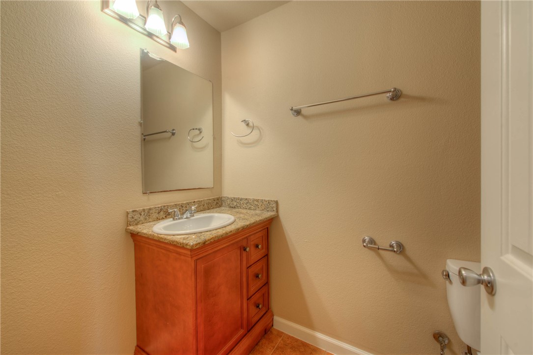 4805 Evans Avenue, Unit B Austin, TX 78751 - Photo 19 of 25 a bathroom with a sink and a mirror
