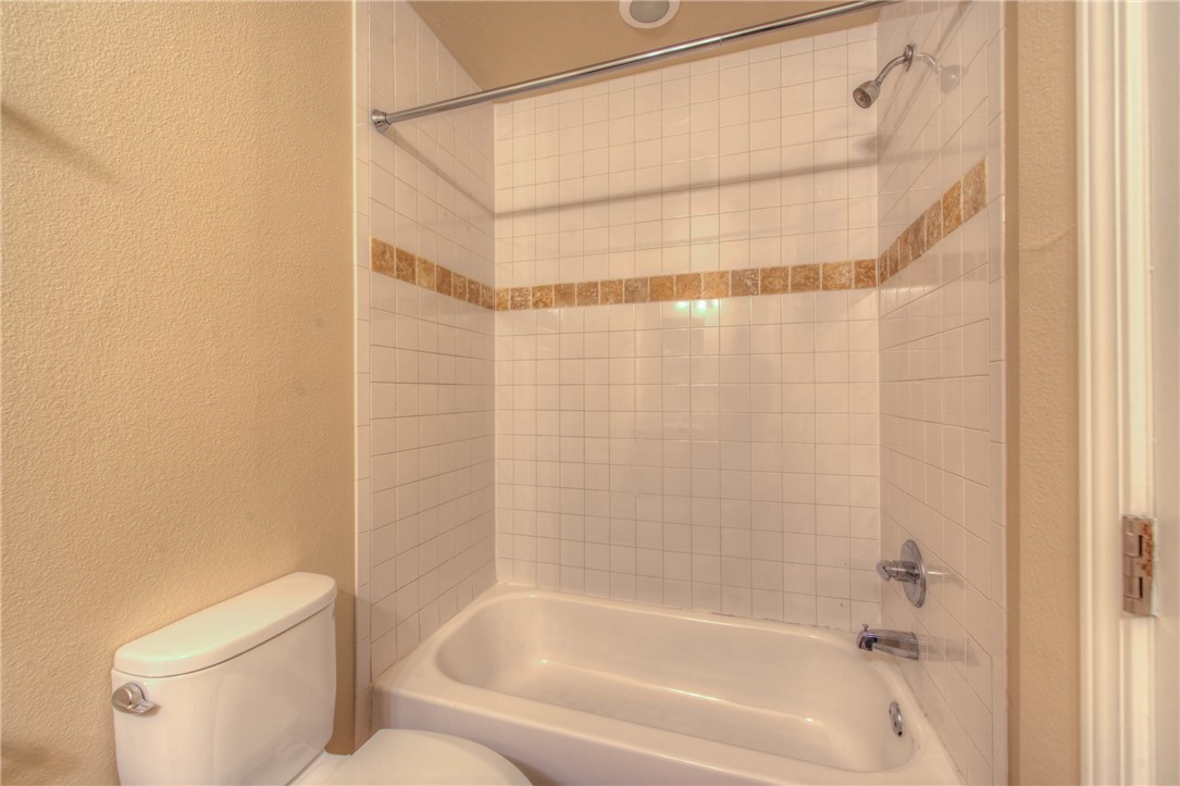 4805 Evans Avenue, Unit B Austin, TX 78751 - Photo 20 of 25 a bathroom with a shower and a toilet