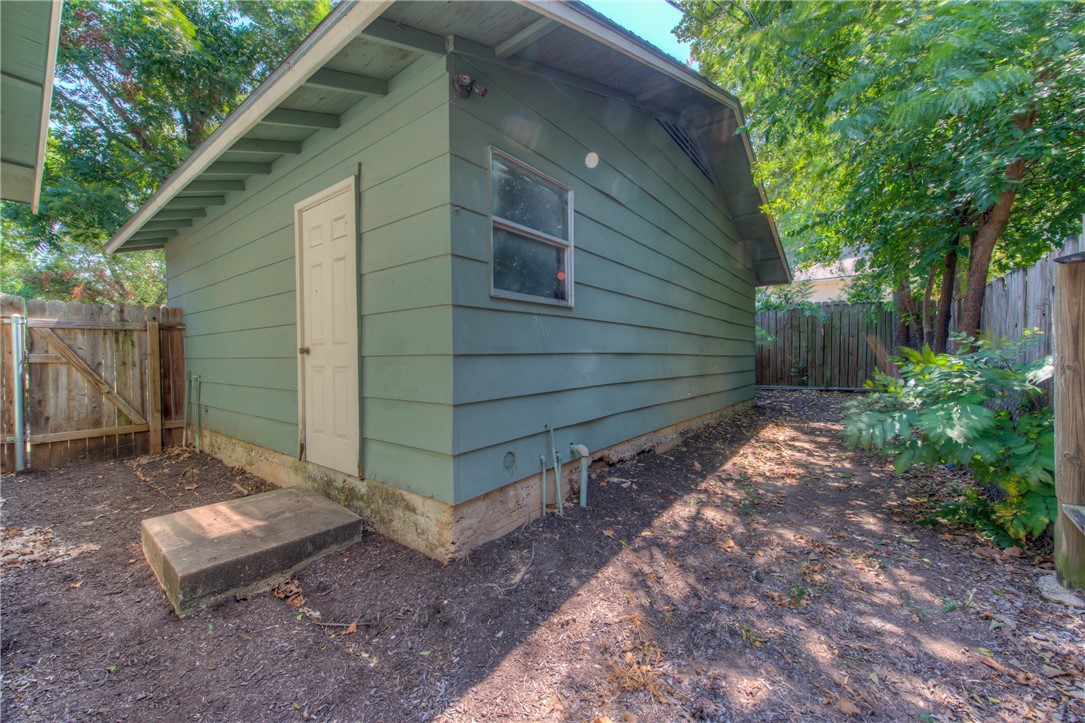 4805 Evans Avenue, Unit B Austin, TX 78751 - Photo 24 of 25 a view of a backyard with chairs and a large tree