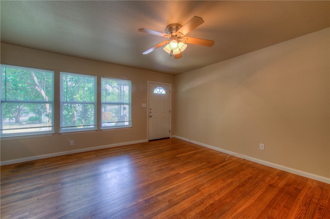 4805 Evans Avenue, Unit B Austin, TX 78751 - Photo 7 of 25 a view of an empty room with wooden floor and a window