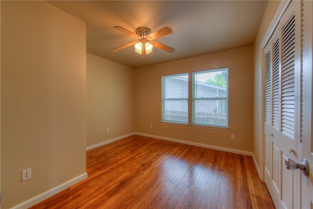 4805 Evans Avenue, Unit B Austin, TX 78751 - Photo 10 of 25 a view of an empty room with wooden floor and a window