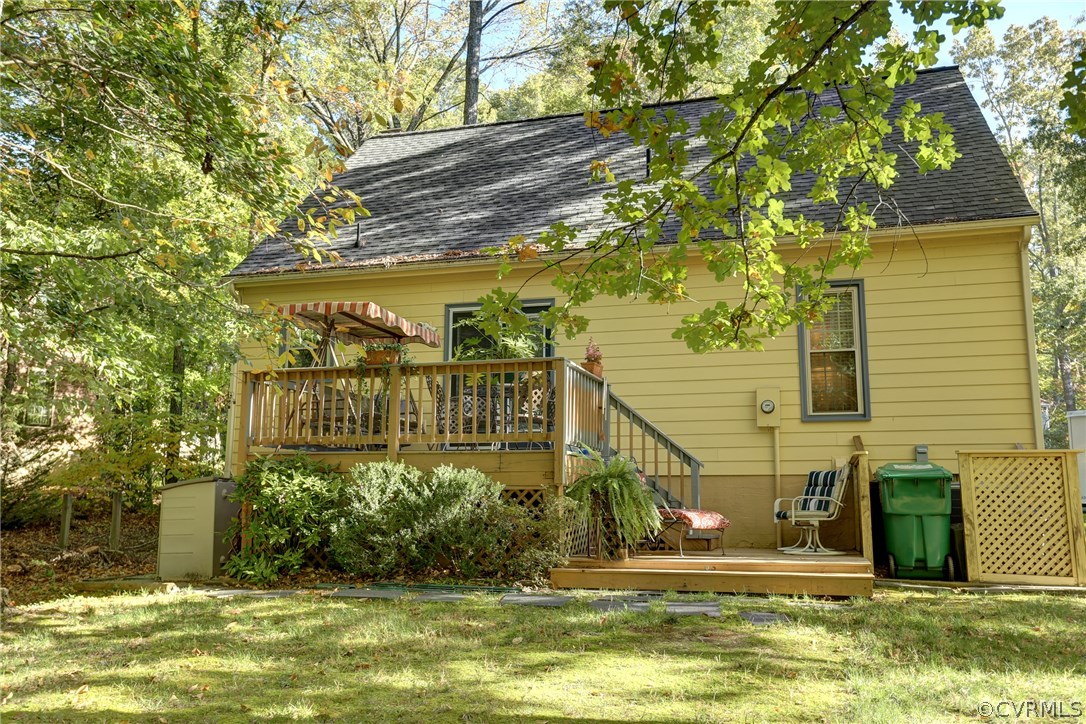 13301 Court Ridge Road Midlothian, VA 23112 - Photo 21 of 24 a view of a house with a small yard plants and large trees