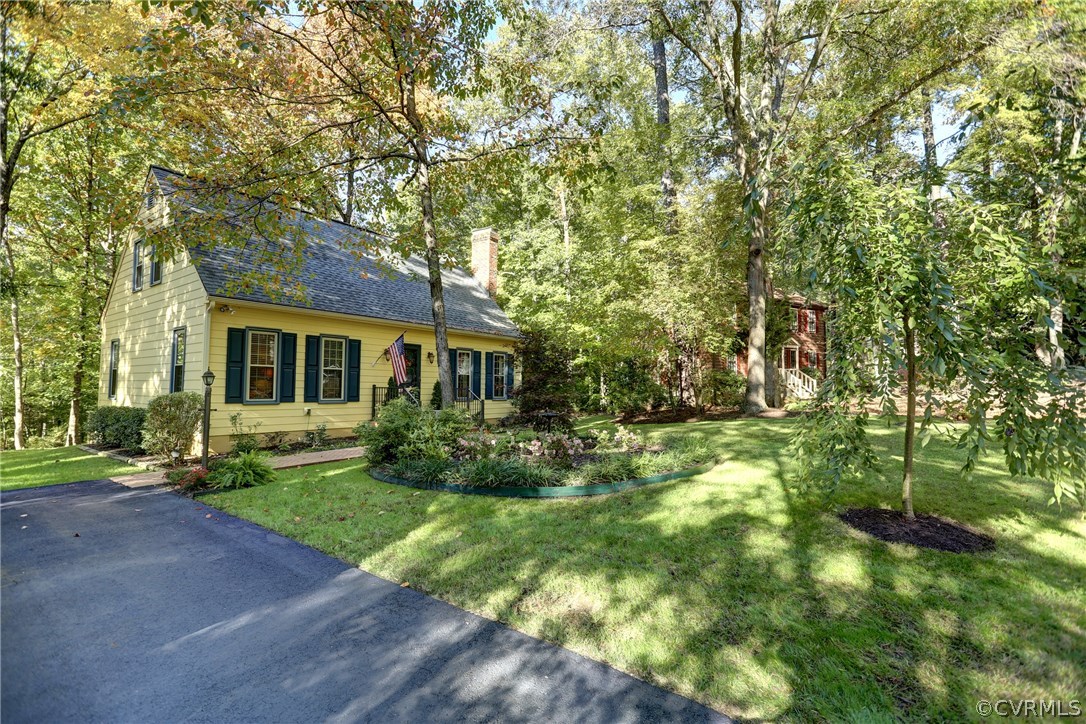 13301 Court Ridge Road Midlothian, VA 23112 - Photo 4 of 24 a view of house in front of a big yard with large trees
