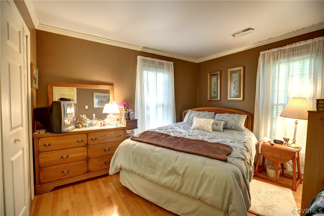 13301 Court Ridge Road Midlothian, VA 23112 - Photo 10 of 24 a bedroom with a bed and a mirror on dresser