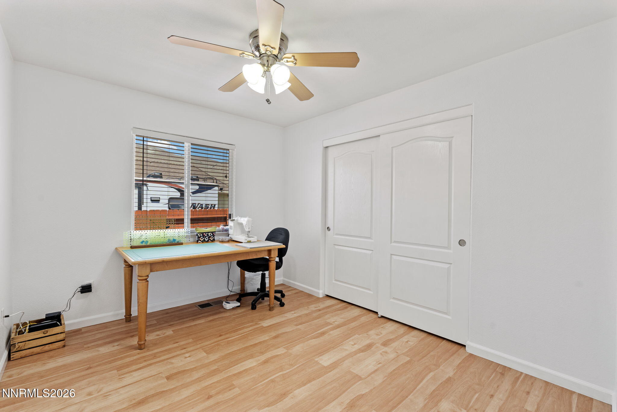 18324 Panda Bear Court Reno, NV 89508 - Photo 20 of 44 a view of a workspace with furniture and a window