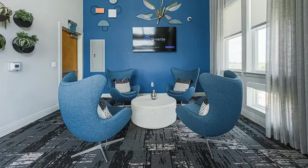 a living room with furniture and a window