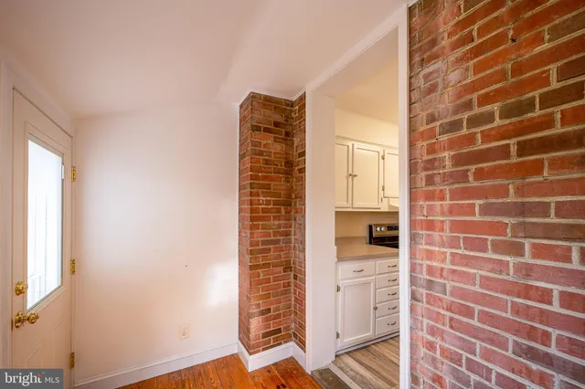a bathroom with a shower and a sink
