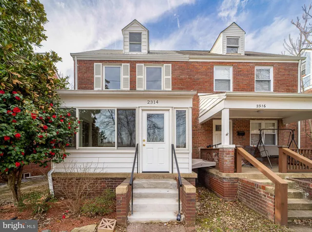 a front view of a house with a porch