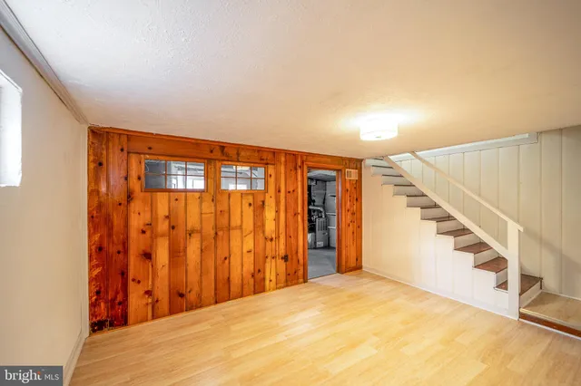 a view of an empty room with stairs