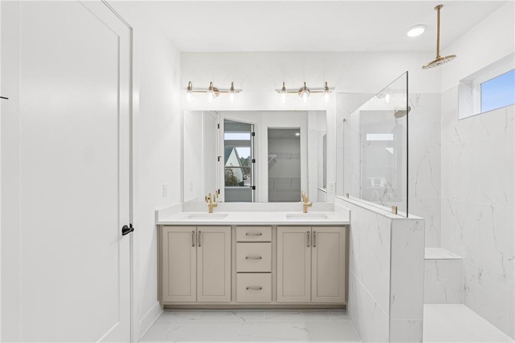 1041 Pine Bark Lane Canton, GA 30114 - Photo 12 of 19 a bathroom with a sink double vanity and a mirror
