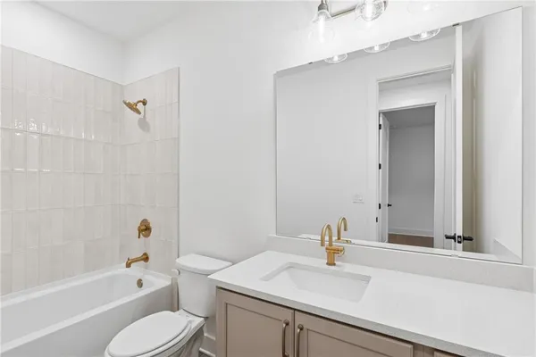 a bathroom with a sink a toilet and a bathtub