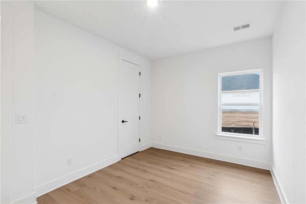 1041 Pine Bark Lane Canton, GA 30114 - Photo 14 of 19 an empty room with a window