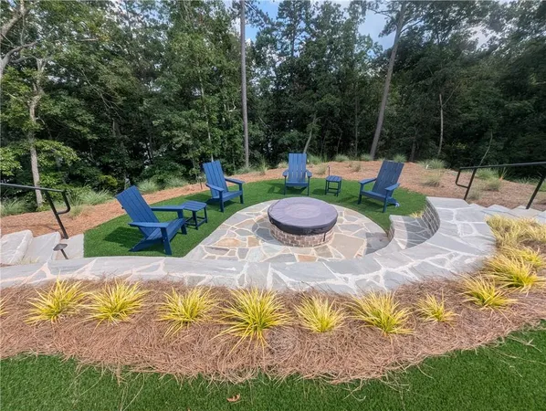 a view of an outdoor space with lounge chairs