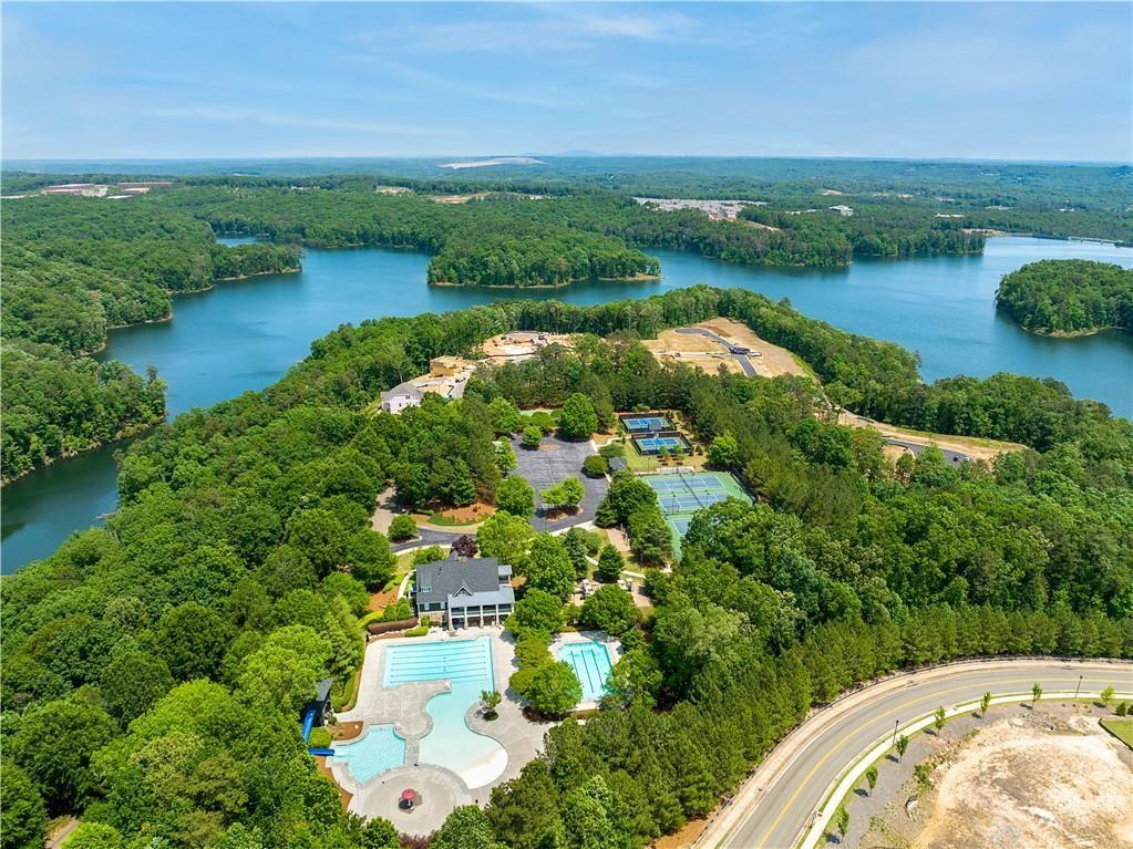 1041 Pine Bark Lane Canton, GA 30114 - Photo 18 of 19 an aerial view of lake residential house with outdoor space and trees around