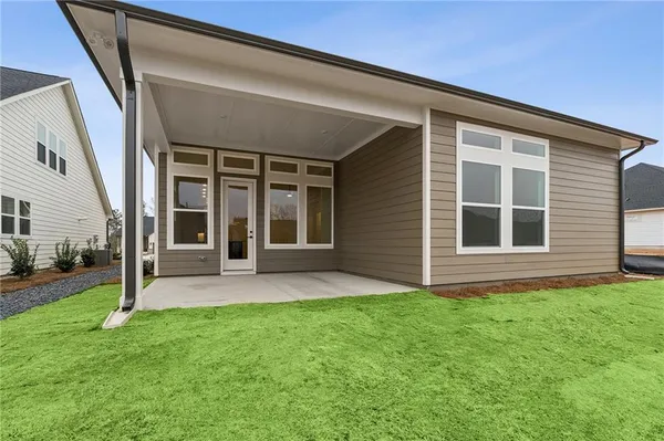 a view of front door of house and yard