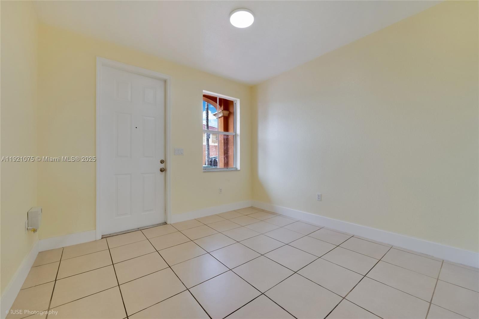24331 Southwest 108th Place Homestead, FL 33032 - Photo 2 of 15 a view of an empty room and window