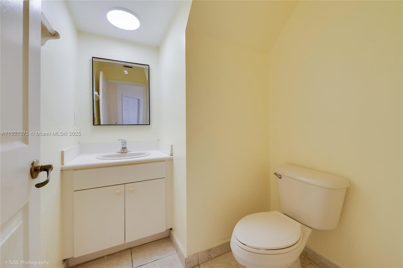 24331 Southwest 108th Place Homestead, FL 33032 - Photo 3 of 15 a bathroom with a toilet sink vanity and mirror