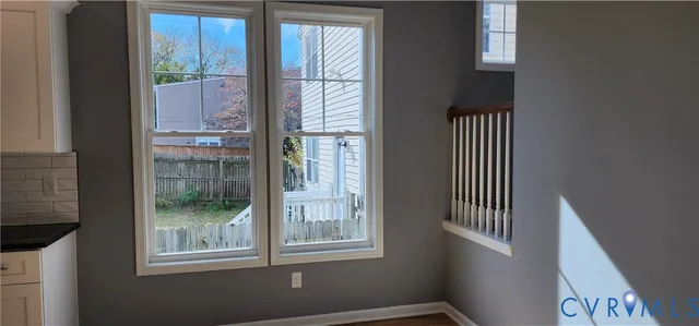 a view of empty room with windows