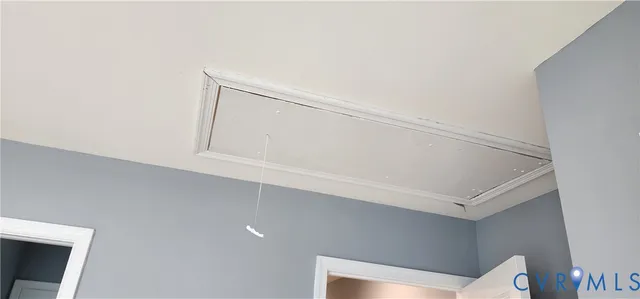 a view of entryway with kitchen