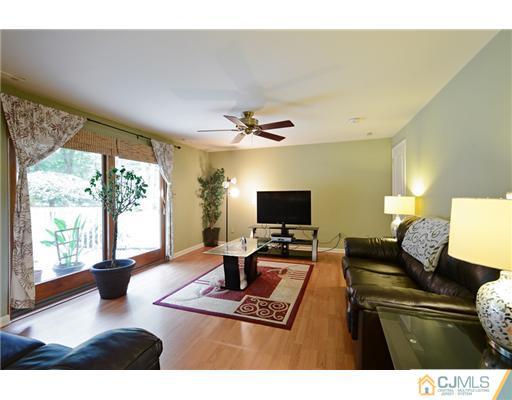 10 Midland Road Edison, NJ 08820 - Photo 11 of 18 a living room with furniture and a flat screen tv