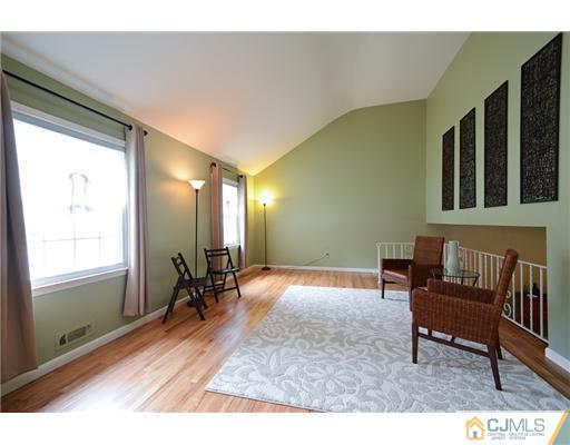 10 Midland Road Edison, NJ 08820 - Photo 5 of 18 a view of a livingroom with furniture and windows