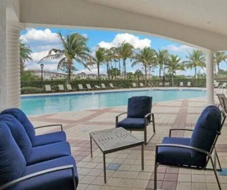 a balcony with furniture and view of lake