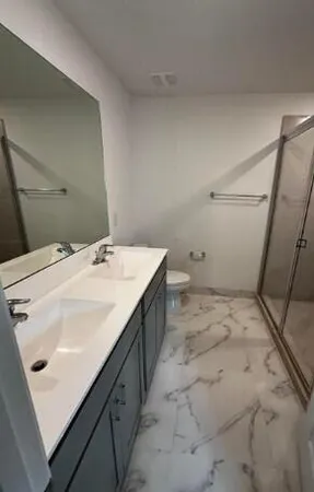 a bathroom with a sink and mirror