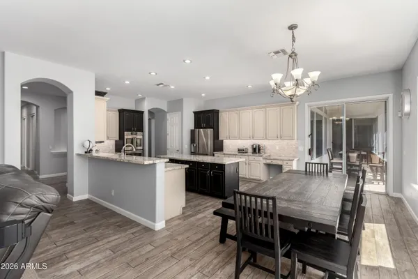a kitchen with granite countertop cabinets stainless steel appliances and a sink