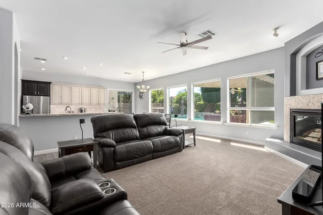 a large bathroom with a large tub and double vanity
