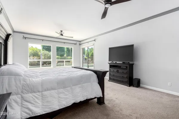 a large bathroom with a large tub and double vanity