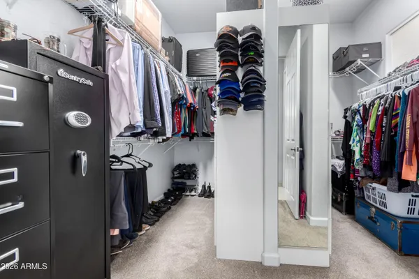 a bedroom with a bed and a cabinets