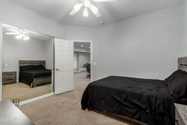 a bathroom with a double vanity sink mirror and bathtub