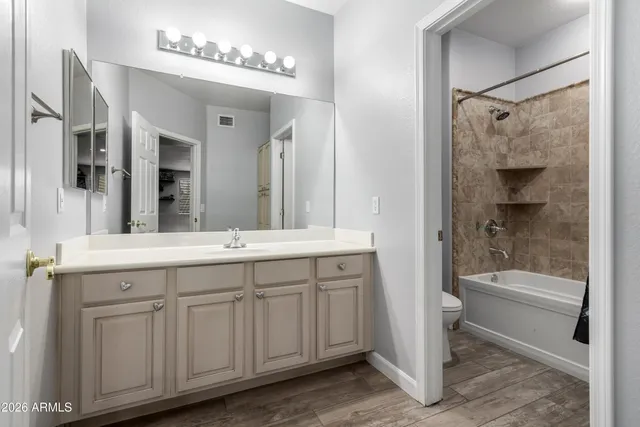 a bedroom with a bed and a cabinet