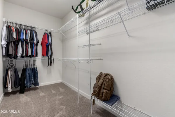 a bedroom with a bed and a cabinet