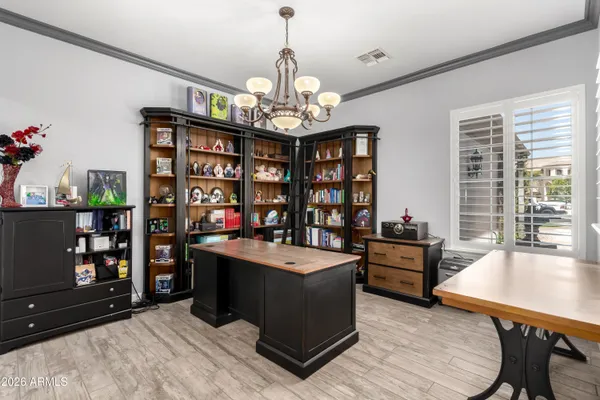 a view of a kitchen with sink and cabinets