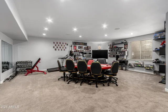 a swimming pool view with a outdoor seating space