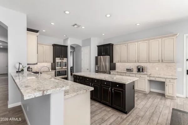 a front view of a house with a yard and a garage