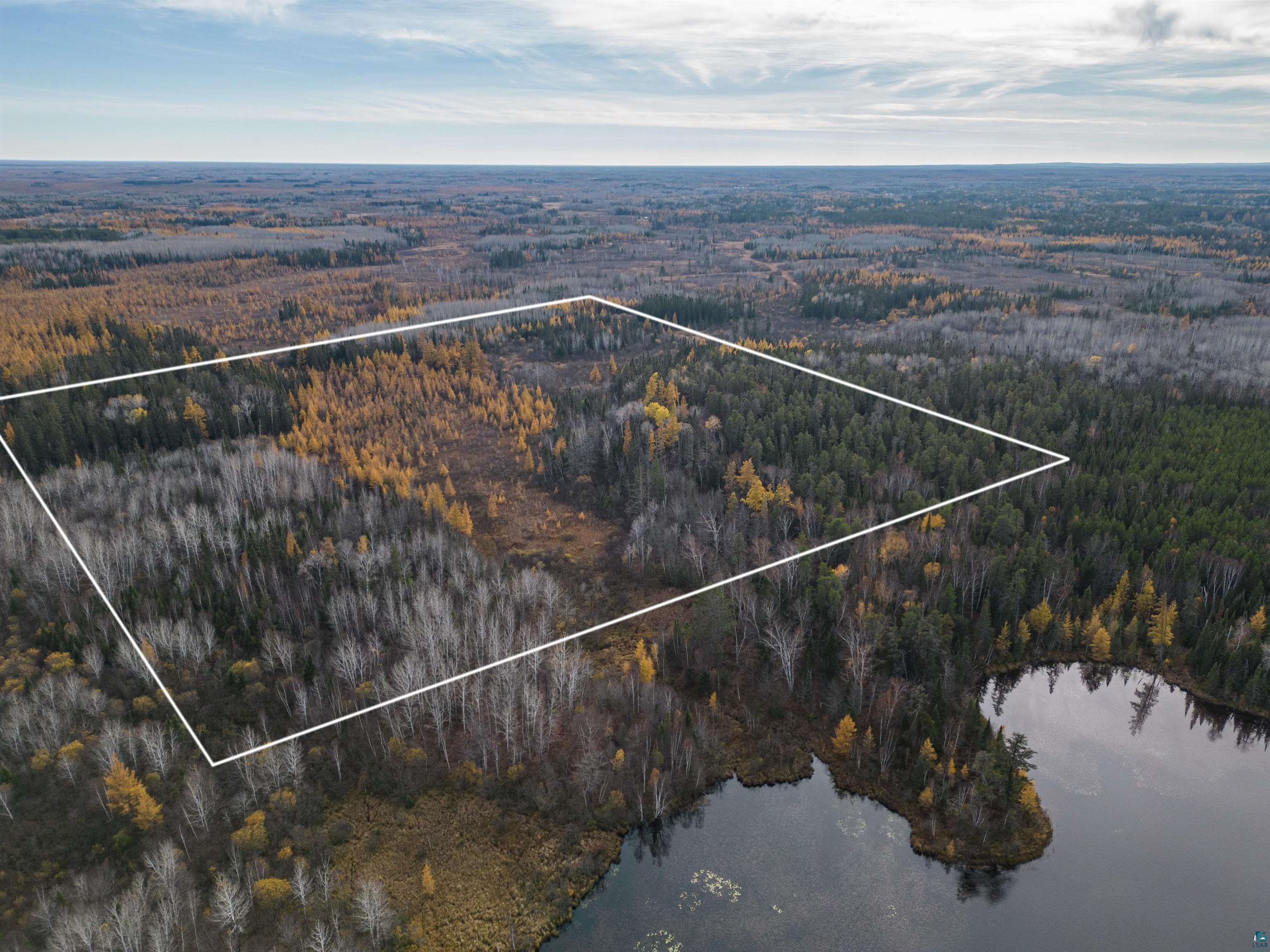 Tbd Town Line Road Hibbing, MN 55746 - Photo 3 of 11 Birds eye view of property featuring a water view