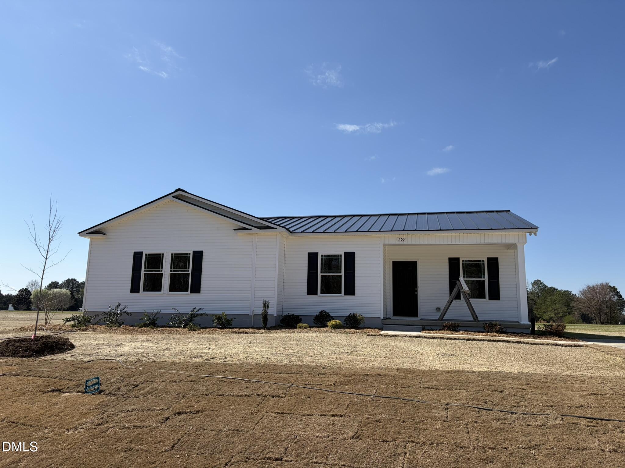 159 Jacobs Ridge Drive Four Oaks, NC 27524 - Photo 1 of 19 a view of a white house with a yard
